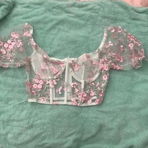 This is a corset with poofy sleeves